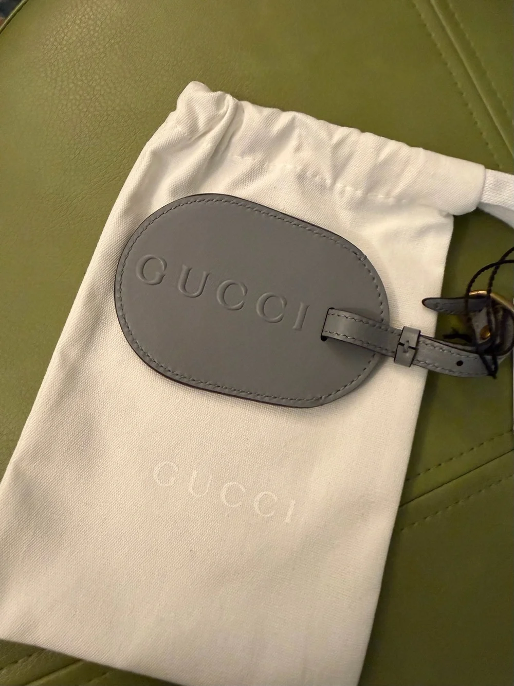 NWT Gucci Gray Oval Leather Luggage Tag with Embossed Logo